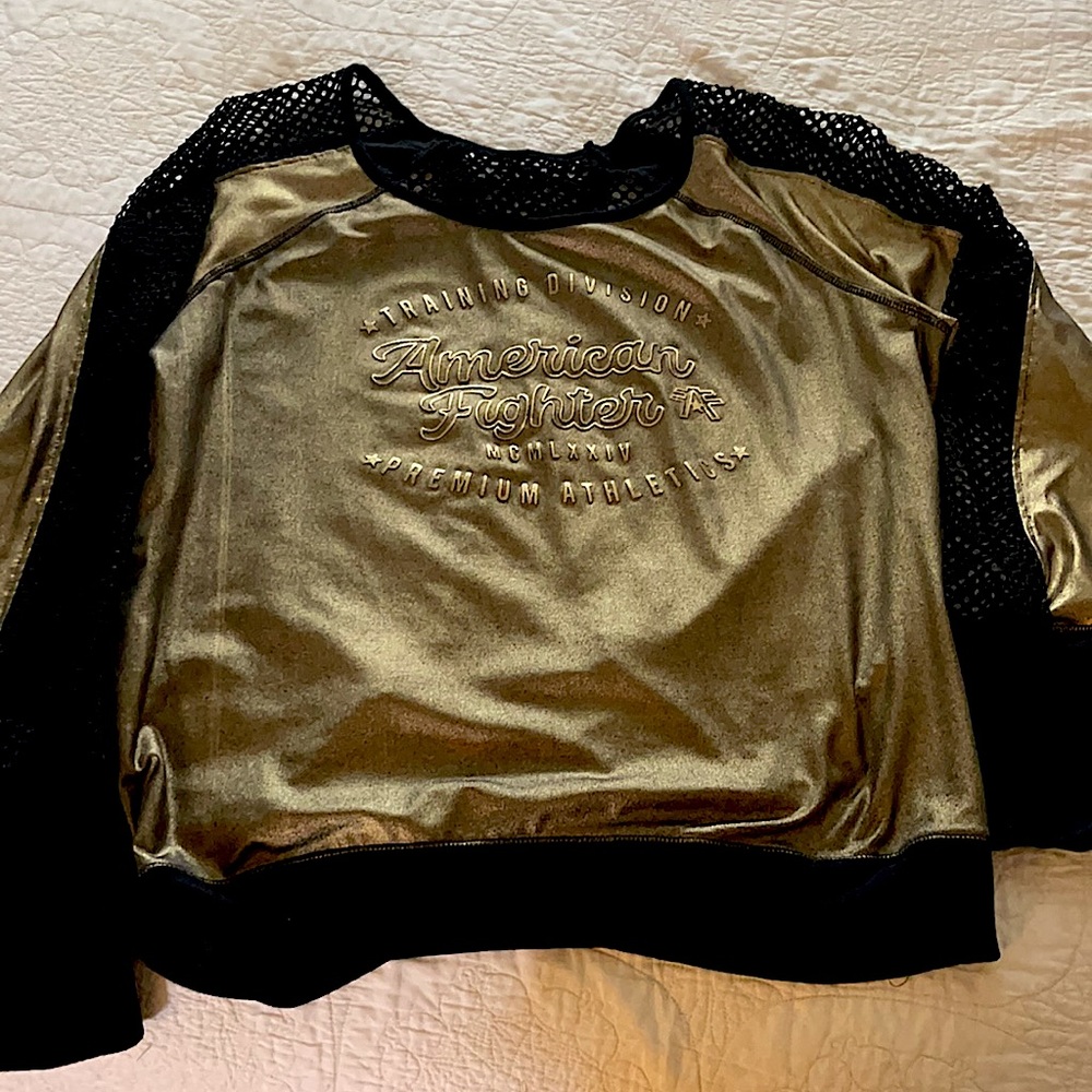 Woman’s Affliction gold workout top